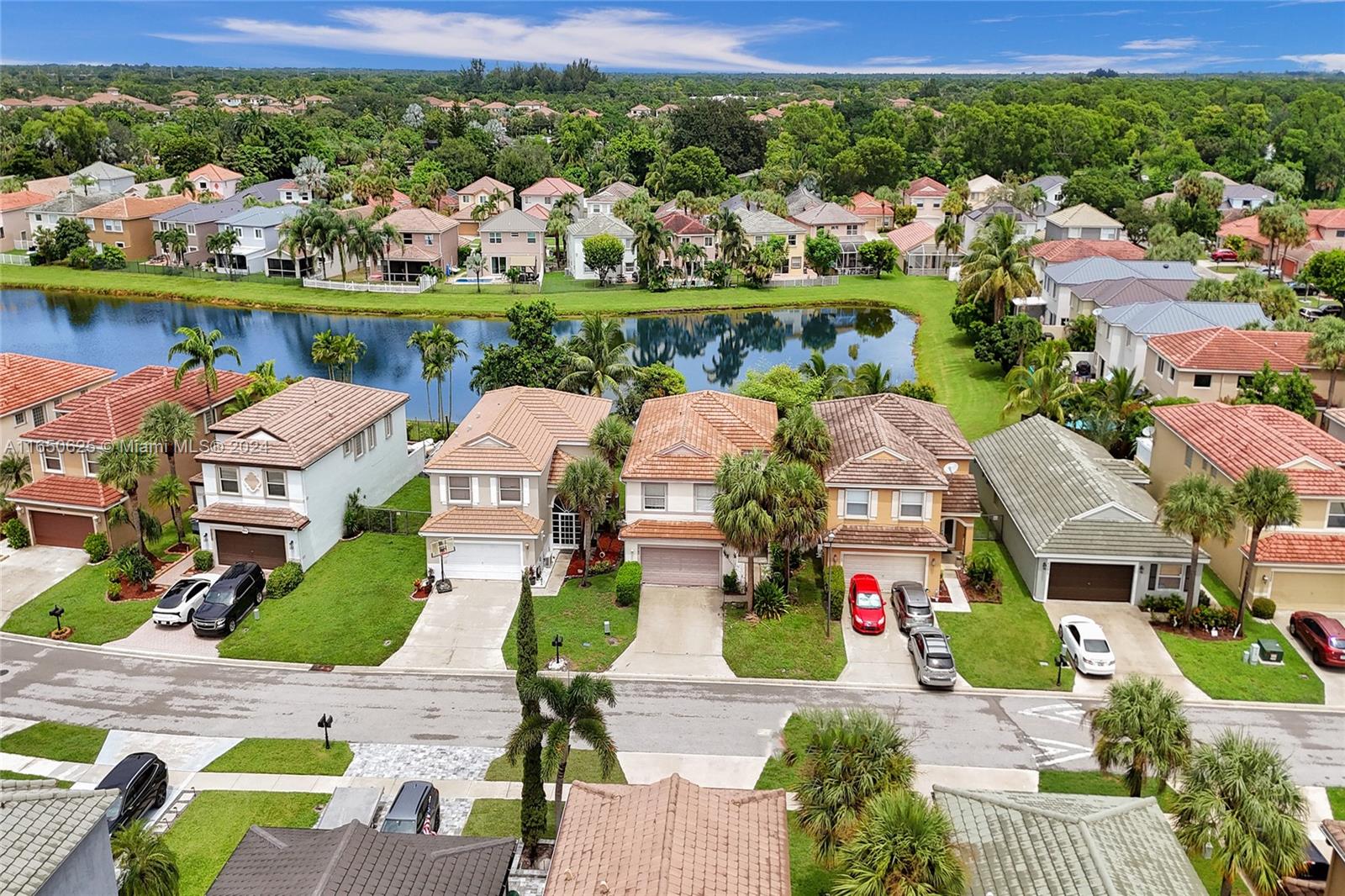 6073 Spring Isles Boulevard Lake Worth, FL 33463 - Photo 57 of 66 an aerial view of house with yard swimming pool and outdoor seating