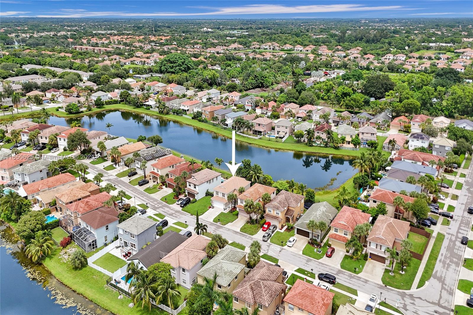 6073 Spring Isles Boulevard Lake Worth, FL 33463 - Photo 58 of 66 an aerial view of residential houses with outdoor space and street view