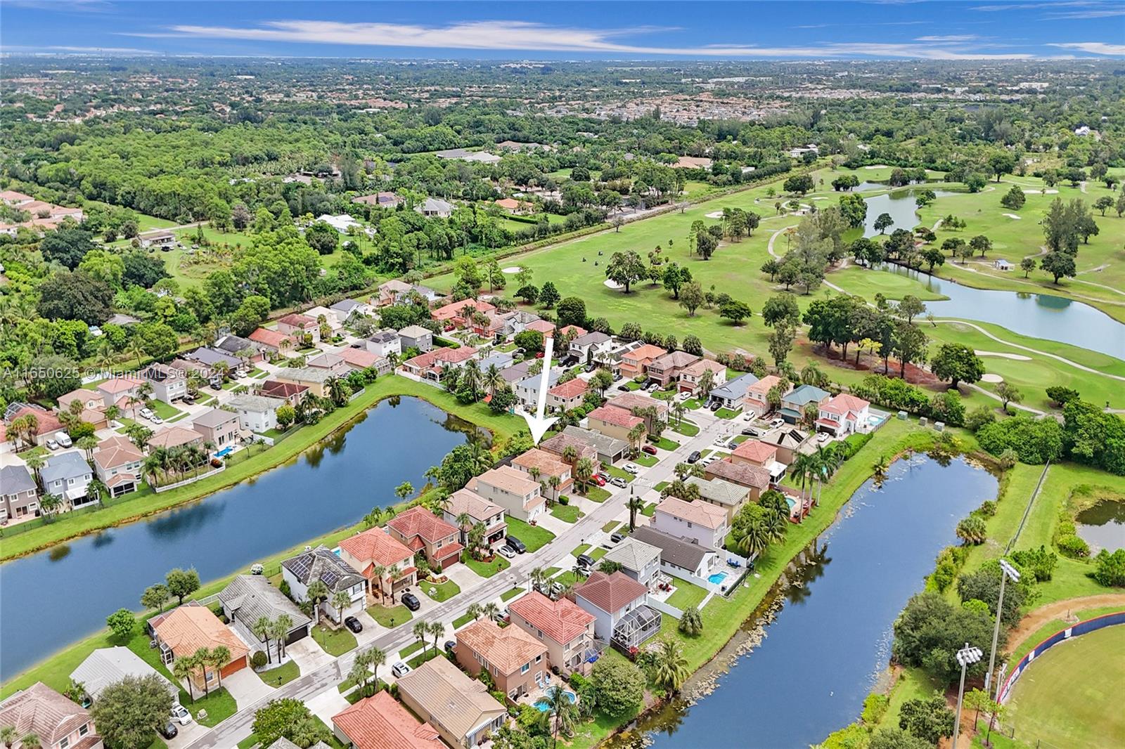 6073 Spring Isles Boulevard Lake Worth, FL 33463 - Photo 59 of 66 an aerial view of a city