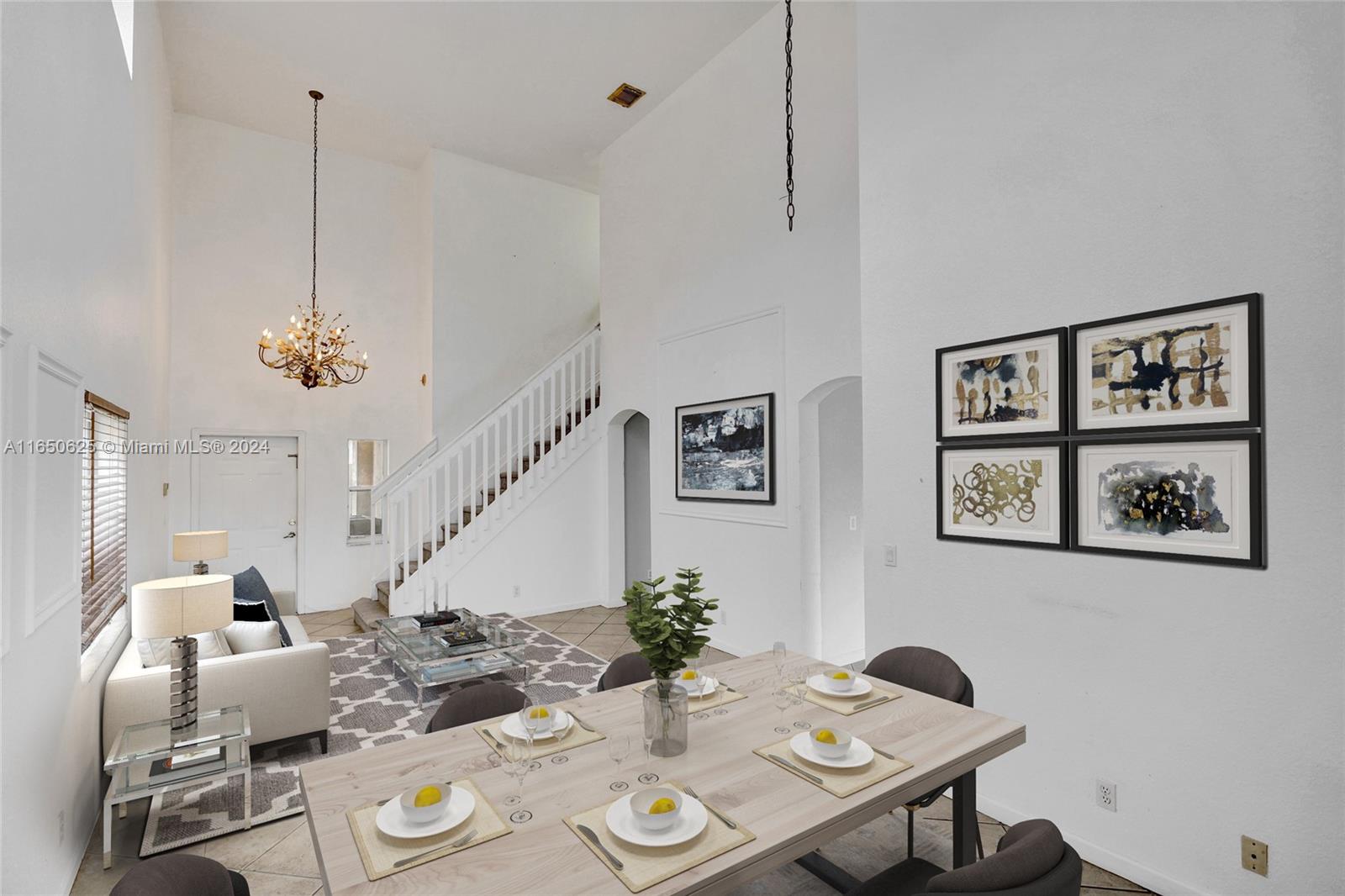 6073 Spring Isles Boulevard Lake Worth, FL 33463 - Photo 6 of 66 a view of a dining room with furniture a rug and wooden floor