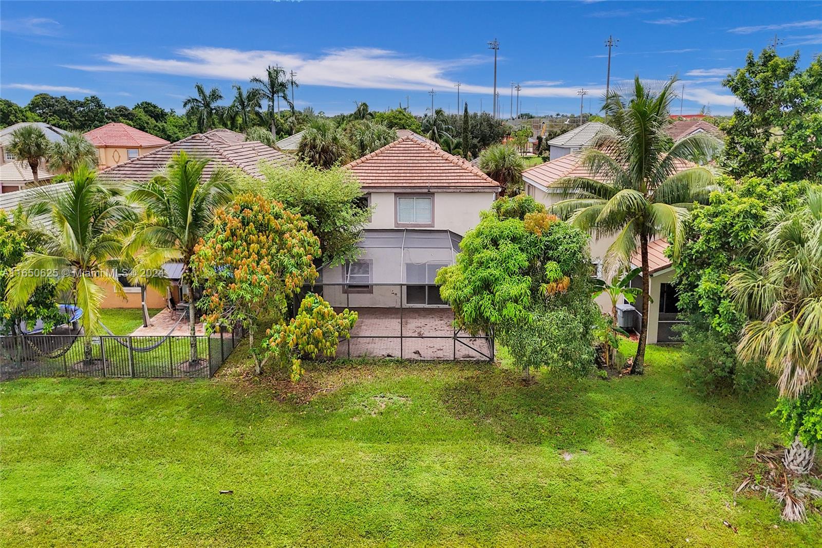 6073 Spring Isles Boulevard Lake Worth, FL 33463 - Photo 61 of 66 a aerial view of a house with a yard and a fountain