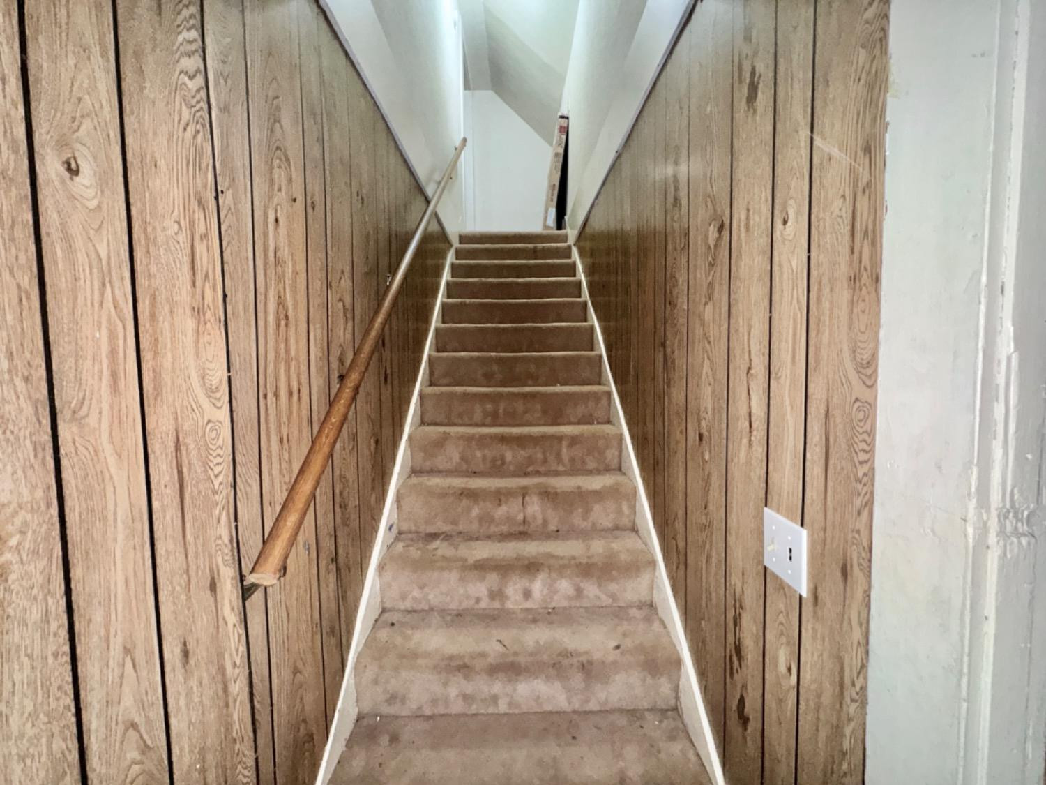 1901 28th Street Lubbock, TX 79411 - Photo 16 of 17 a view of staircase with wooden floor and white walls