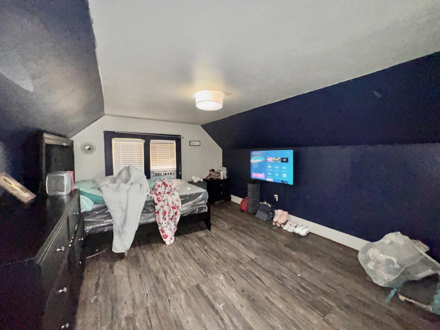 1901 28th Street Lubbock, TX 79411 - Photo 17 of 17 a living room with furniture and a flat screen tv