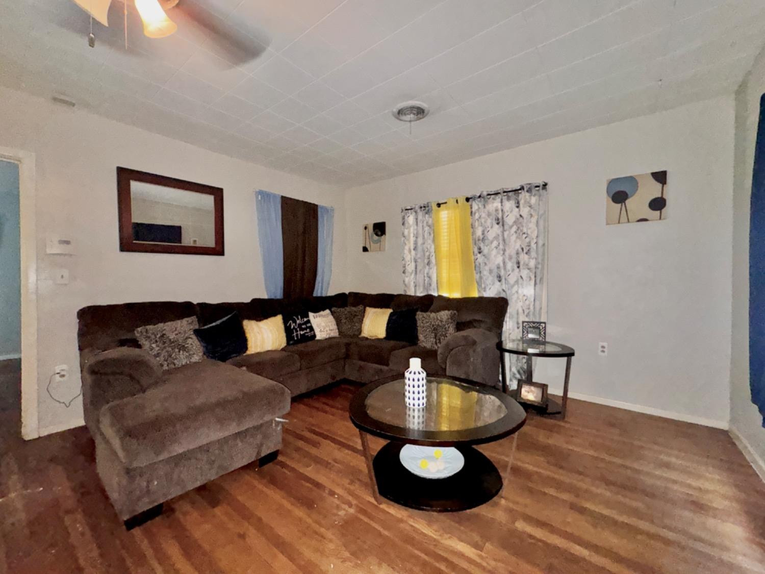 1901 28th Street Lubbock, TX 79411 - Photo 2 of 17 a living room with furniture and wooden floor