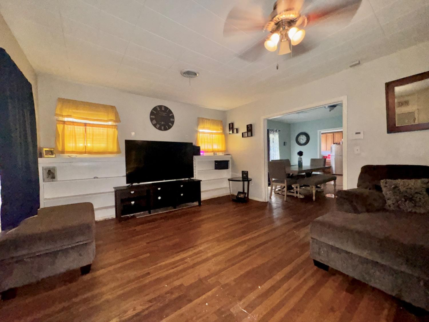 1901 28th Street Lubbock, TX 79411 - Photo 3 of 17 a living room with furniture and a flat screen tv