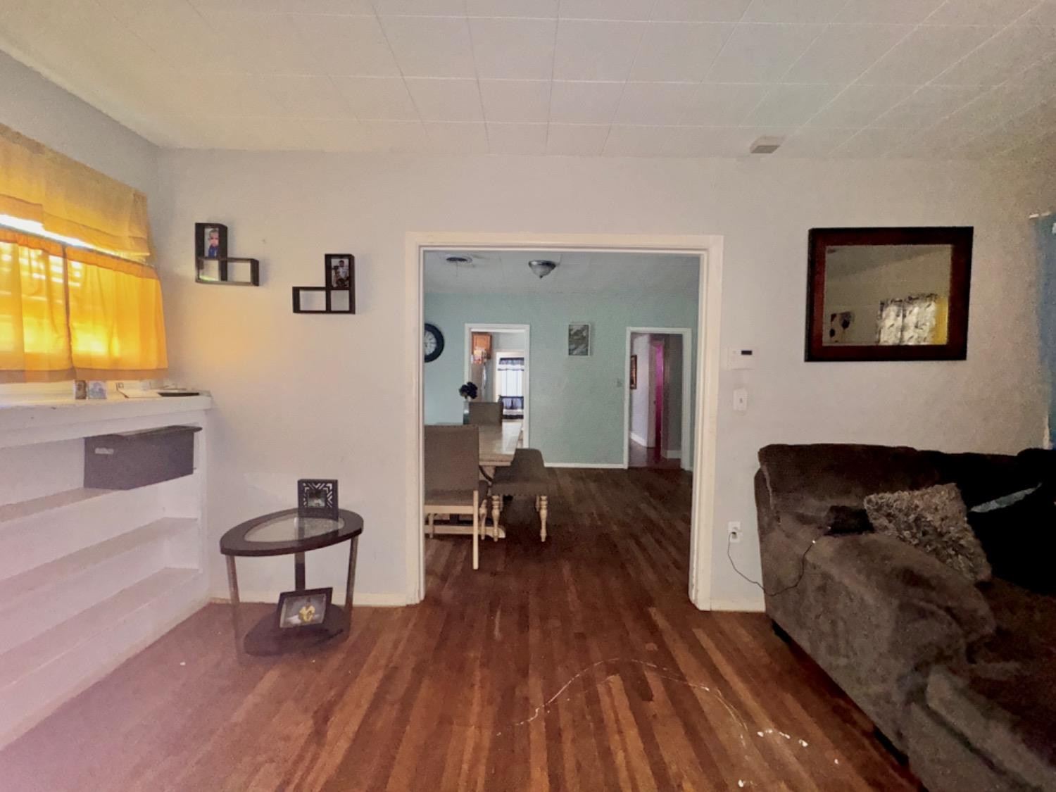 1901 28th Street Lubbock, TX 79411 - Photo 4 of 17 a living room with furniture and a wooden floor