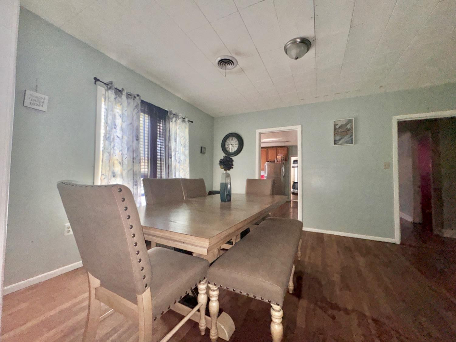 1901 28th Street Lubbock, TX 79411 - Photo 5 of 17 a view of a dining room with furniture and wooden floor