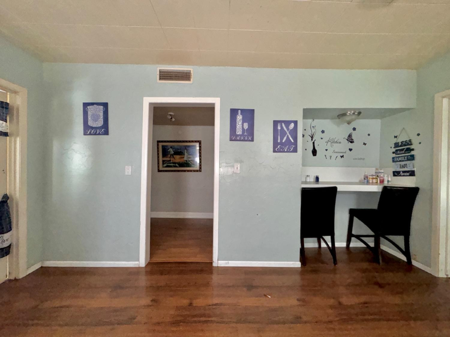 1901 28th Street Lubbock, TX 79411 - Photo 9 of 17 a view of a dining room with furniture and wooden floor