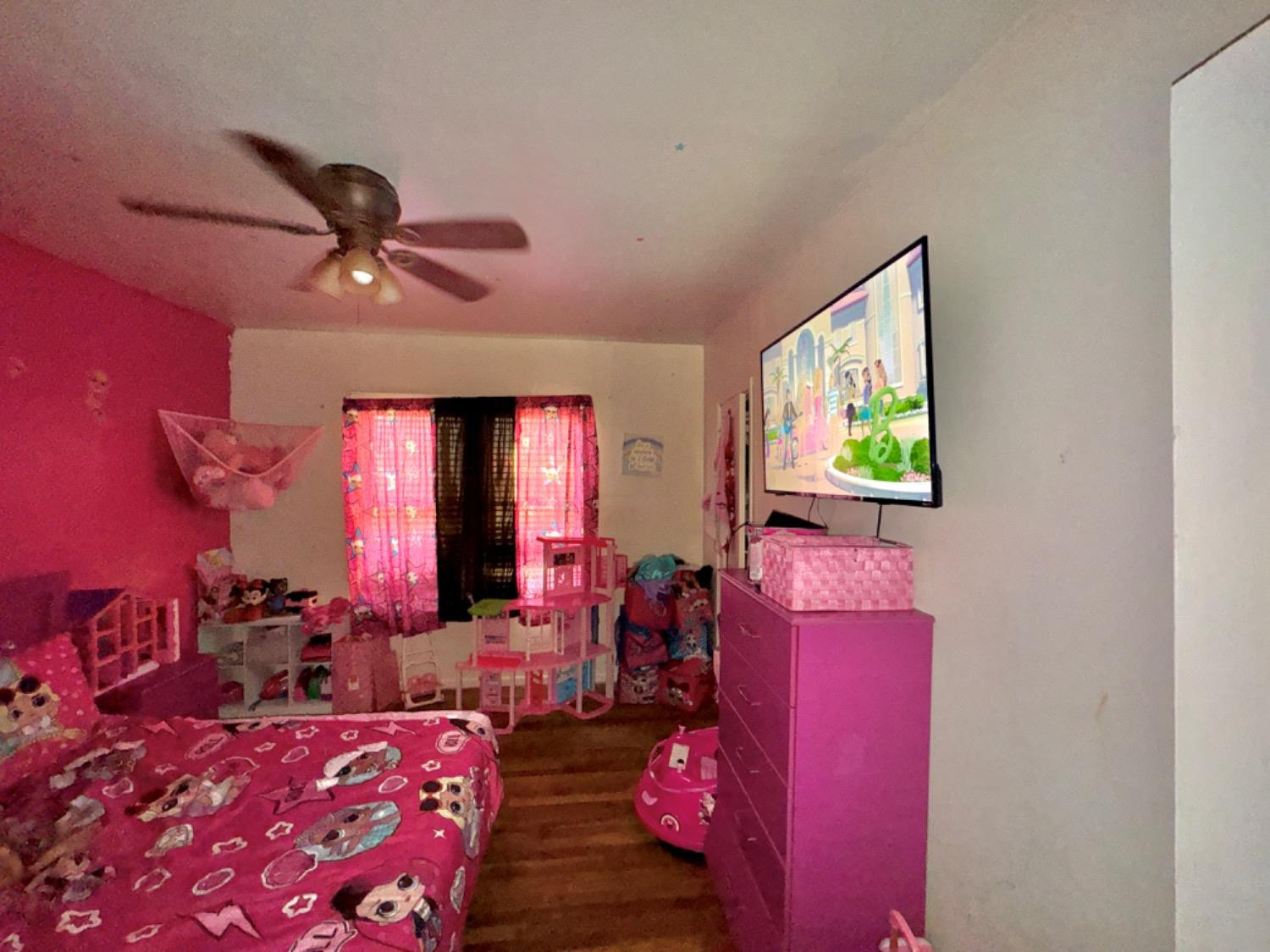1901 28th Street Lubbock, TX 79411 - Photo 10 of 17 a living room with furniture and a flat screen tv
