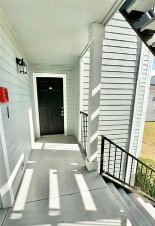 a view of a balcony with a potted plant