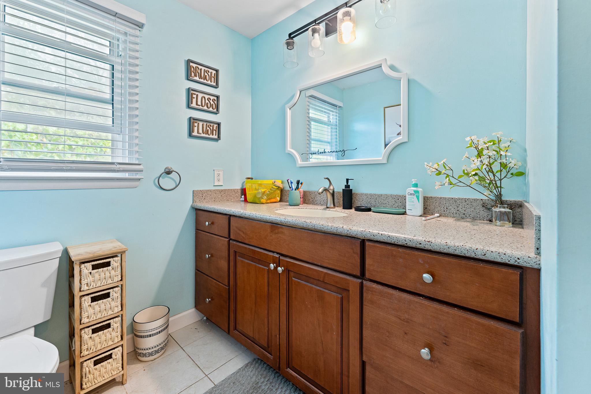 2305 Andover Road Cinnaminson, NJ 08077 - Photo 14 of 31 a bathroom with a granite countertop toilet sink and mirror
