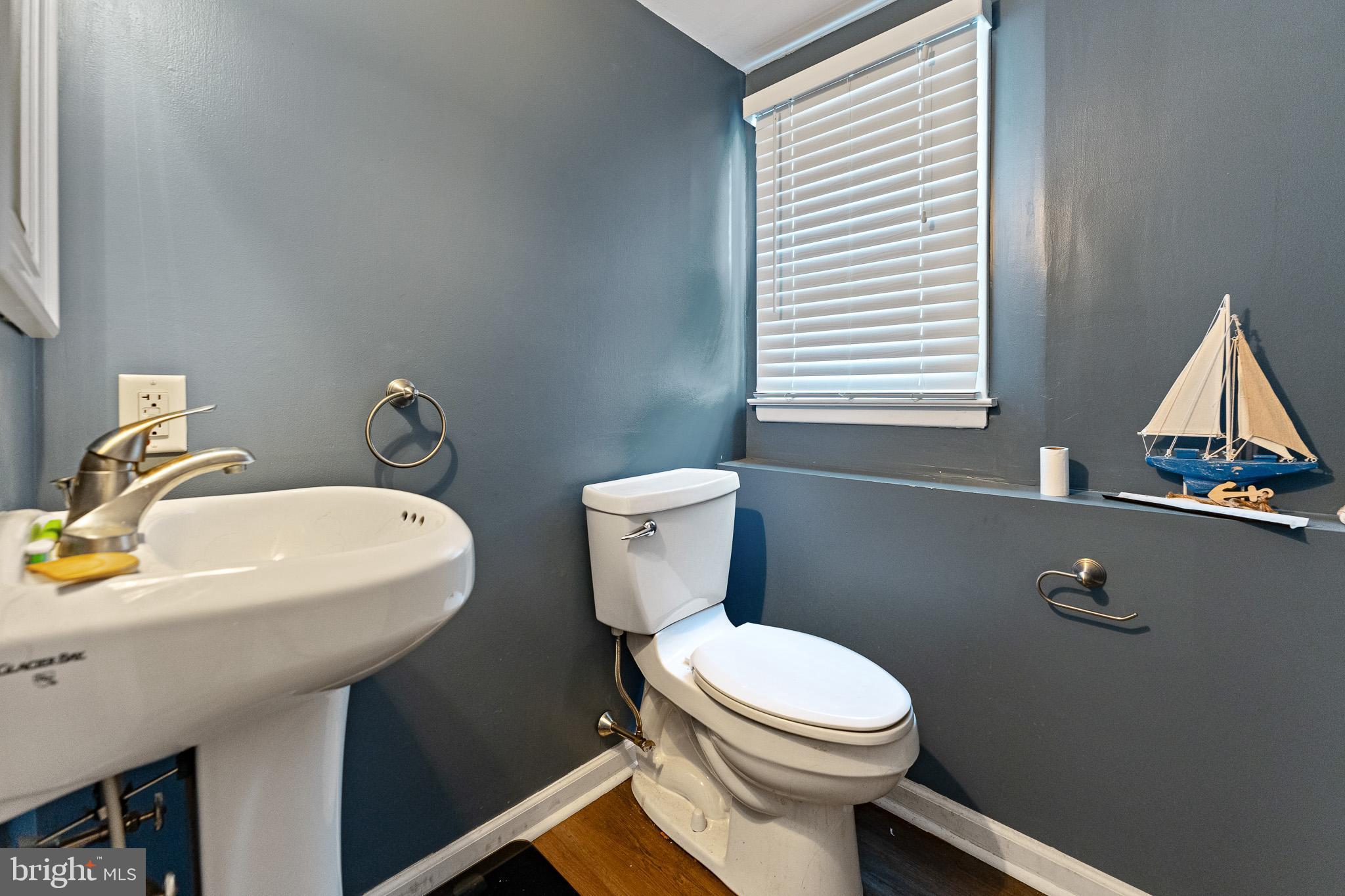 2305 Andover Road Cinnaminson, NJ 08077 - Photo 22 of 31 a bathroom with a toilet a sink and a window