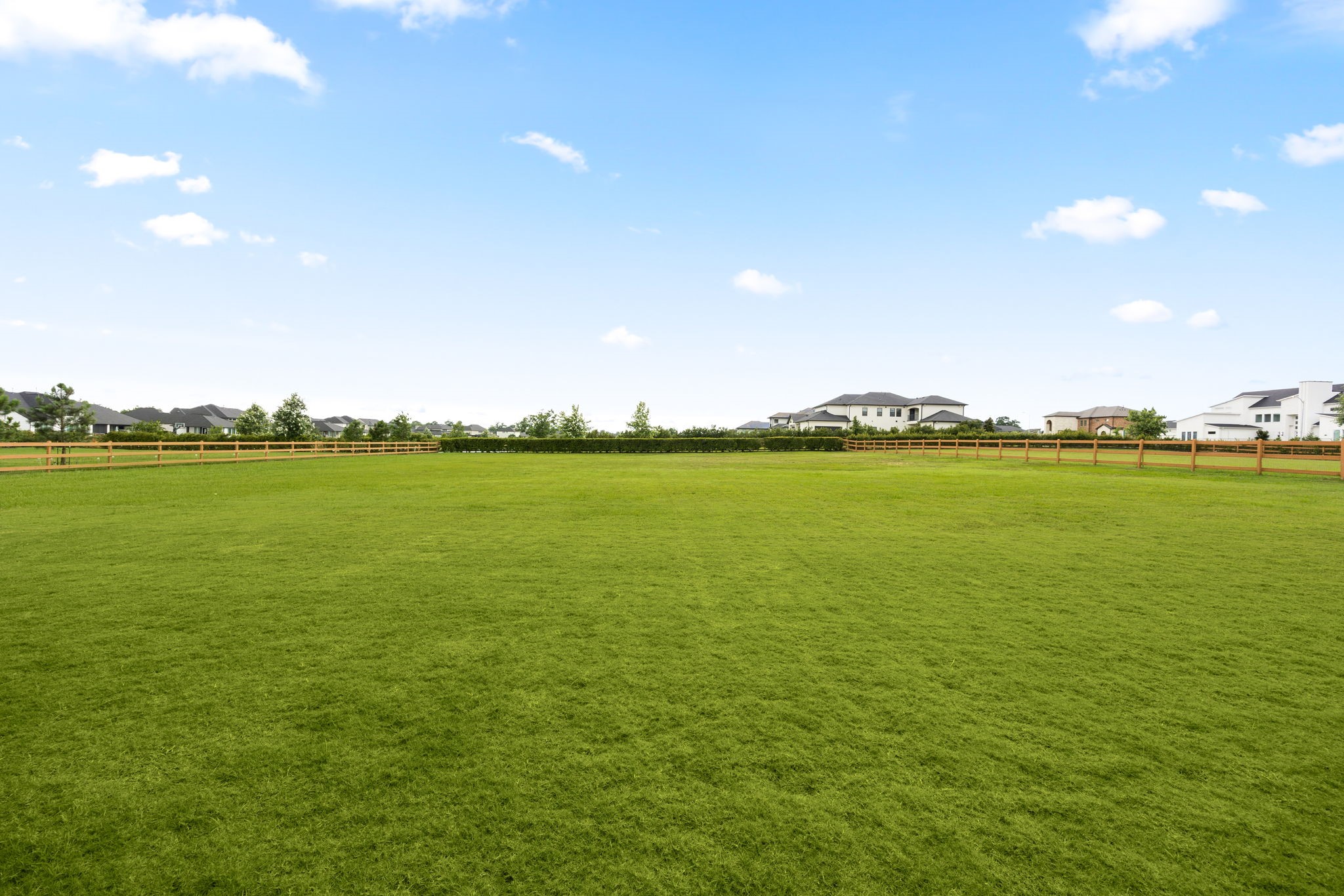 29419 Cir S Rnch Trail Fulshear, TX 77406 - Photo 31 of 45 This broad daytime view highlights the vast, open green space of the yard, offering excellent functionality and privacy for outdoor recreation and unlimited possibilities to create your own private, over the top backyard retreat..