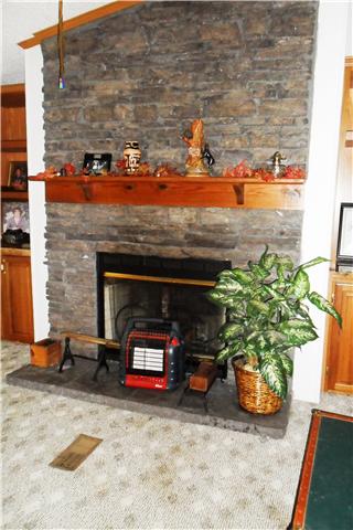 8460 Enterprise Road Mount Pleasant, TN 38474 - Photo 12 of 20 House has large stone fireplace in the family room.