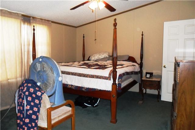 8460 Enterprise Road Mount Pleasant, TN 38474 - Photo 13 of 20 The master bedroom has and attached bath.