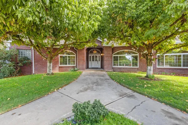 a view of a kitchen with furniture and windows