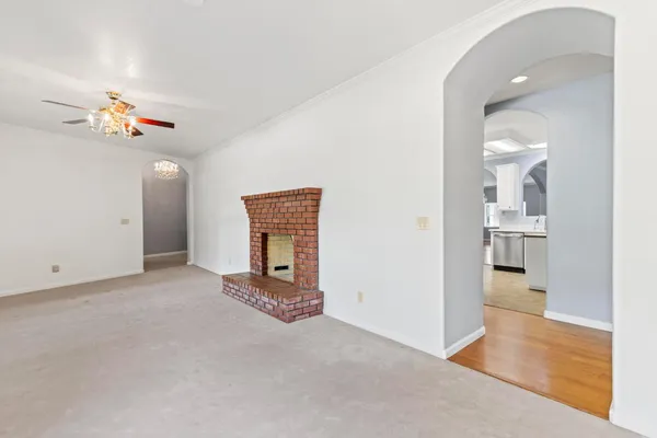 a bathroom with a granite countertop sink a large mirror and a bathtub