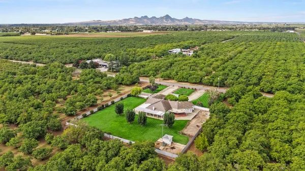 an aerial view of a houses with outdoor space and lake view