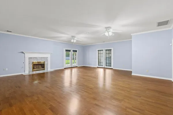 a kitchen with refrigerator and cabinets