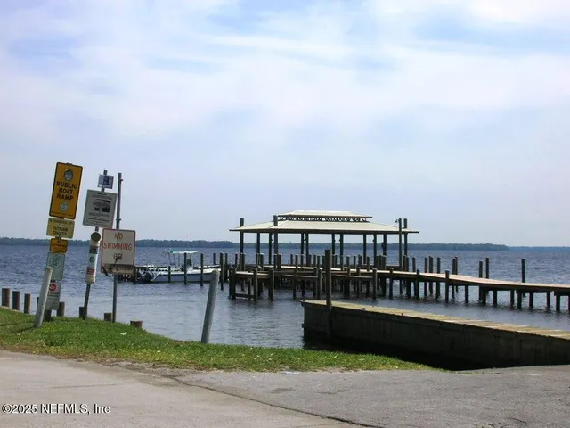 a view of a roof deck with a table and chairs