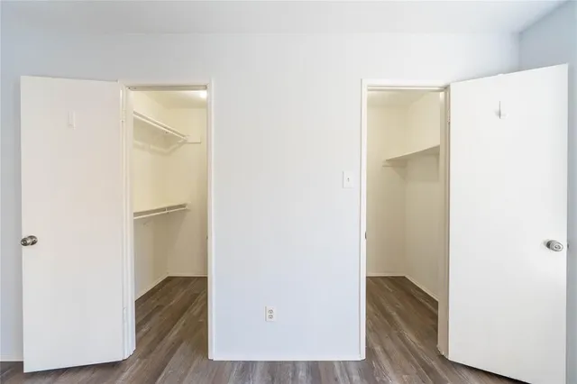 a view of a room with wooden floor and closet