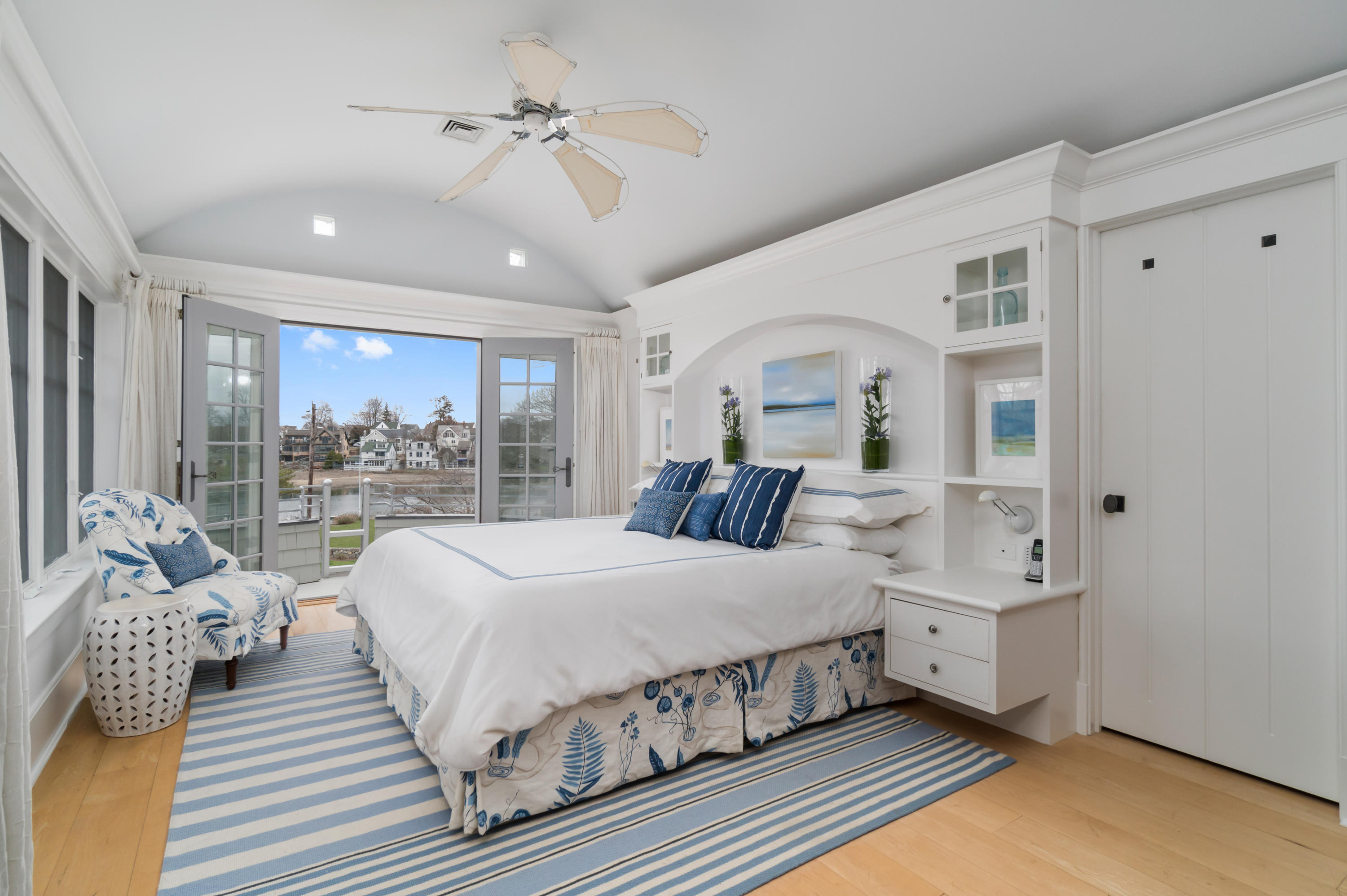 7 Nearwater Road Norwalk, CT 06853 - Photo 11 of 25 a bedroom with a large bed and a chandelier