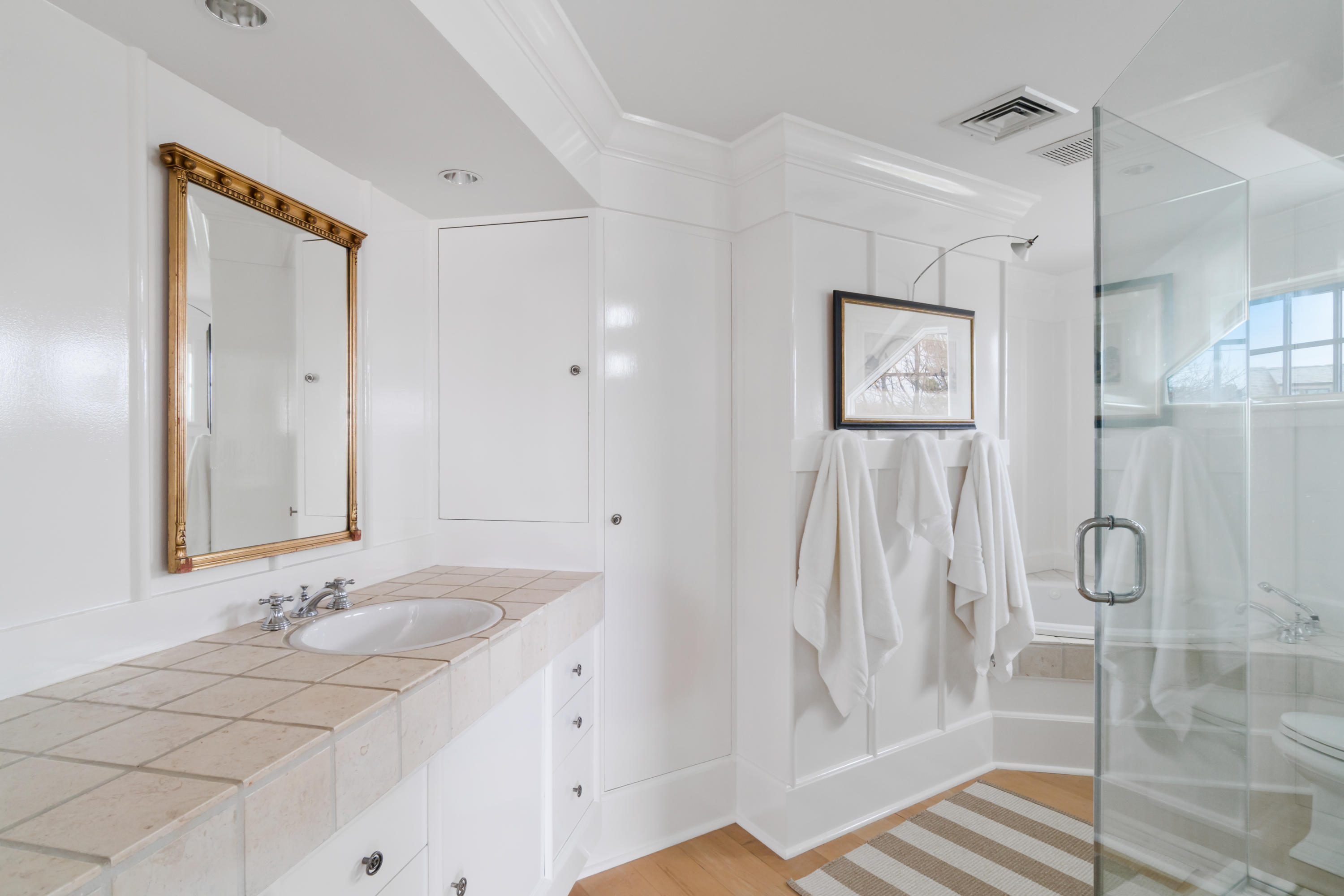 7 Nearwater Road Norwalk, CT 06853 - Photo 13 of 25 a bathroom with a double vanity sink a mirror and a shower