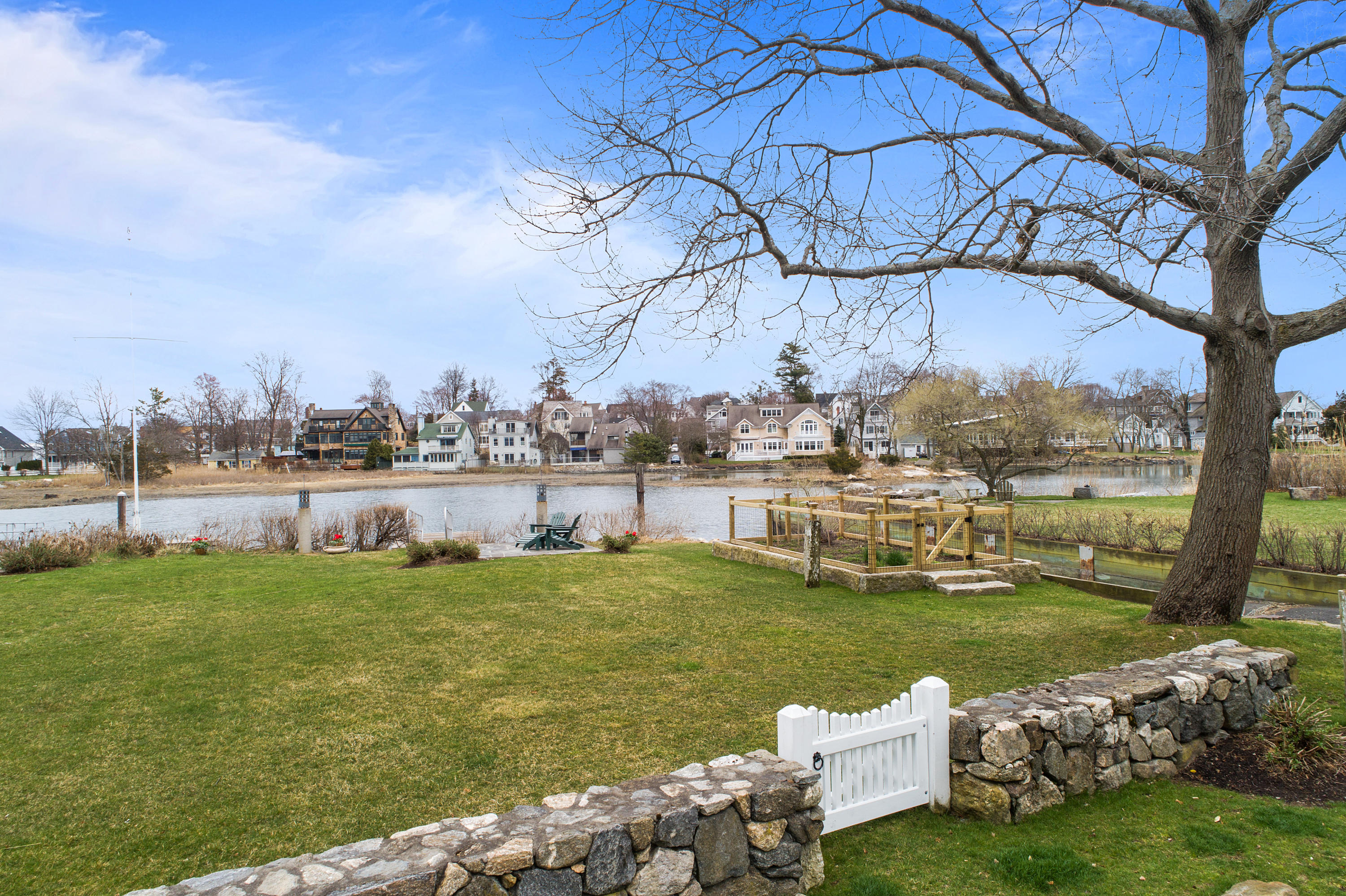 7 Nearwater Road Norwalk, CT 06853 - Photo 21 of 25 a view of a lake with a house in the background