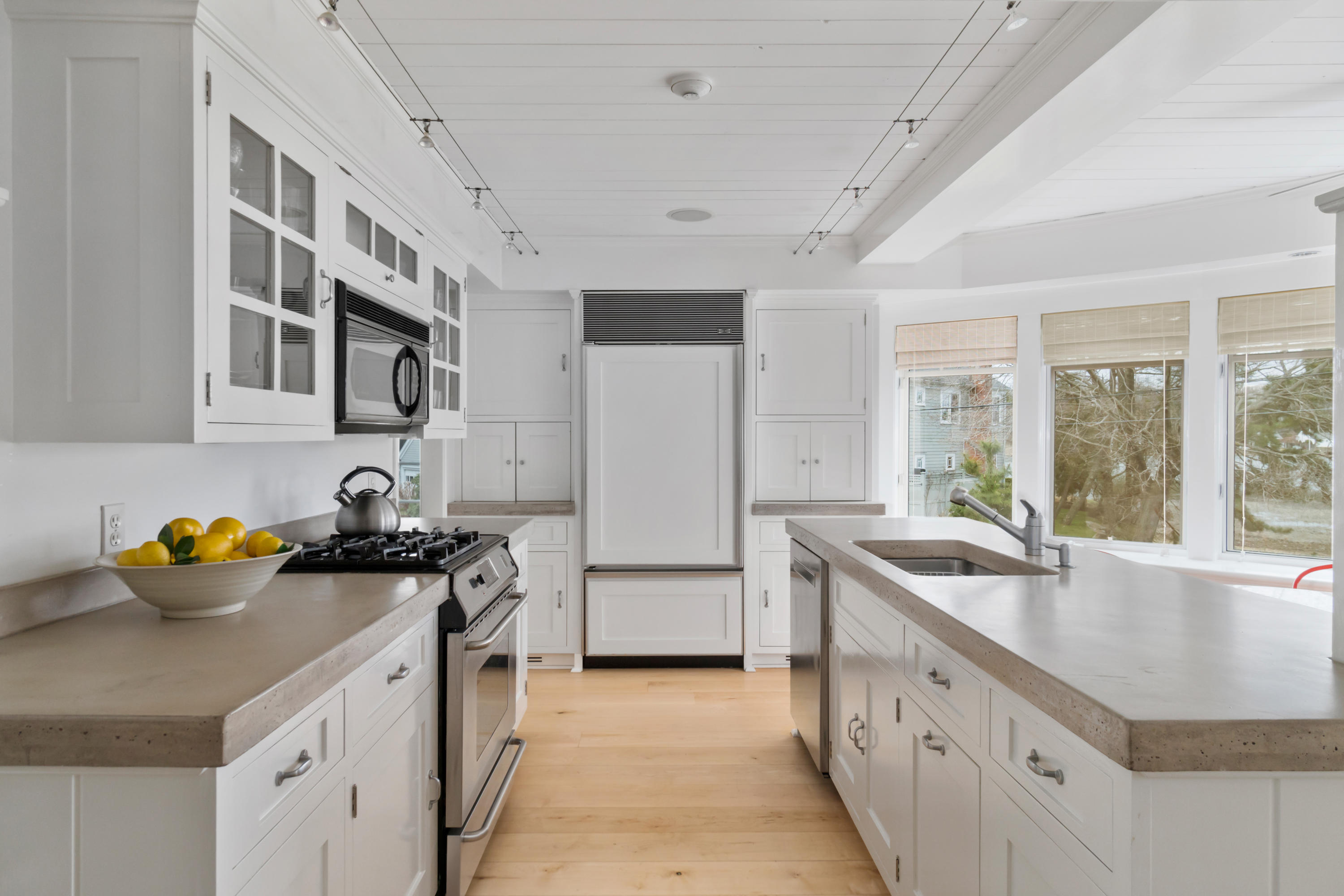 7 Nearwater Road Norwalk, CT 06853 - Photo 9 of 25 a kitchen with a sink stove and cabinets