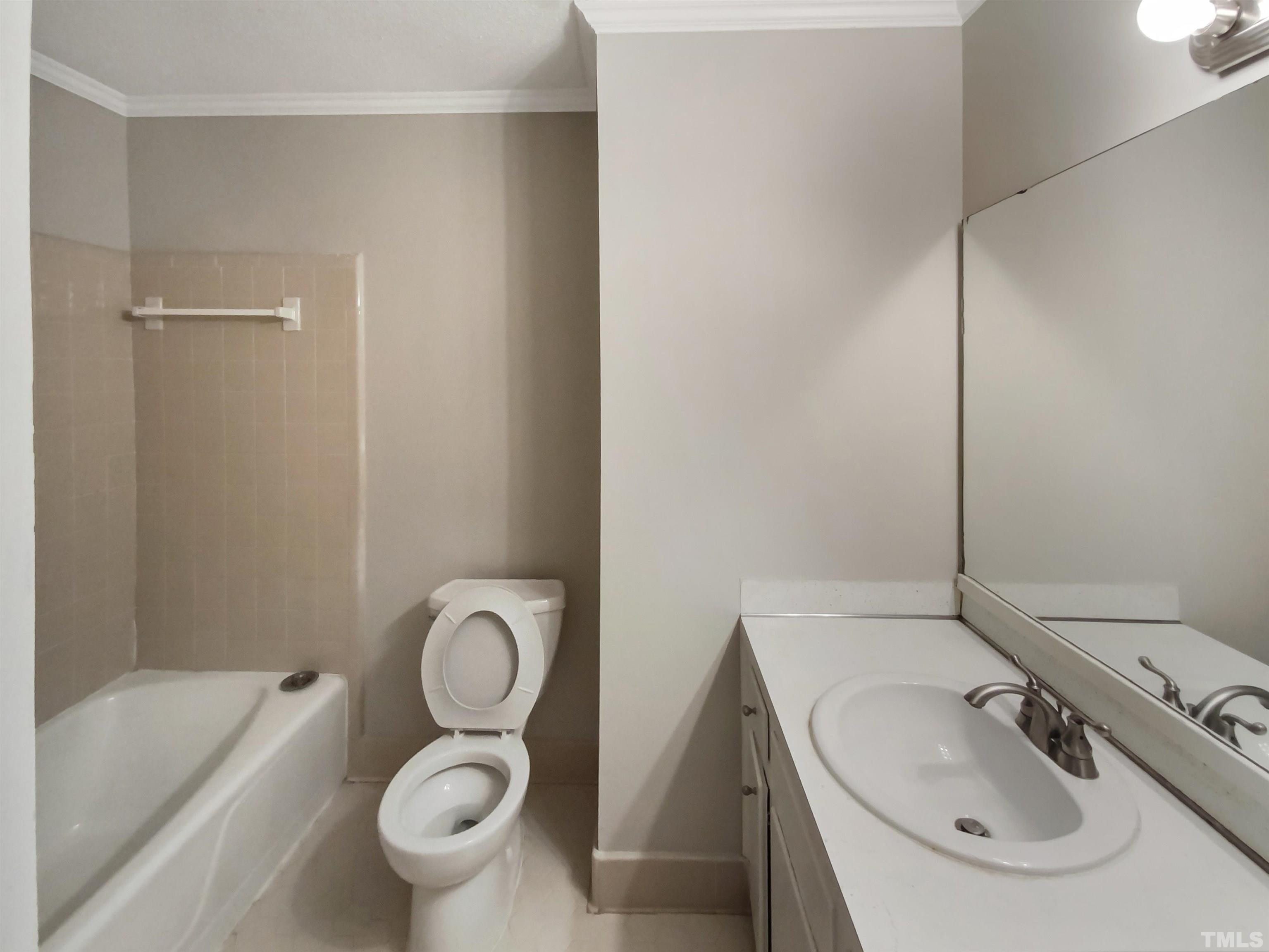 3200 Caldwell Drive Raleigh, NC 27607 - Photo 14 of 19 a bathroom with a toilet sink and mirror