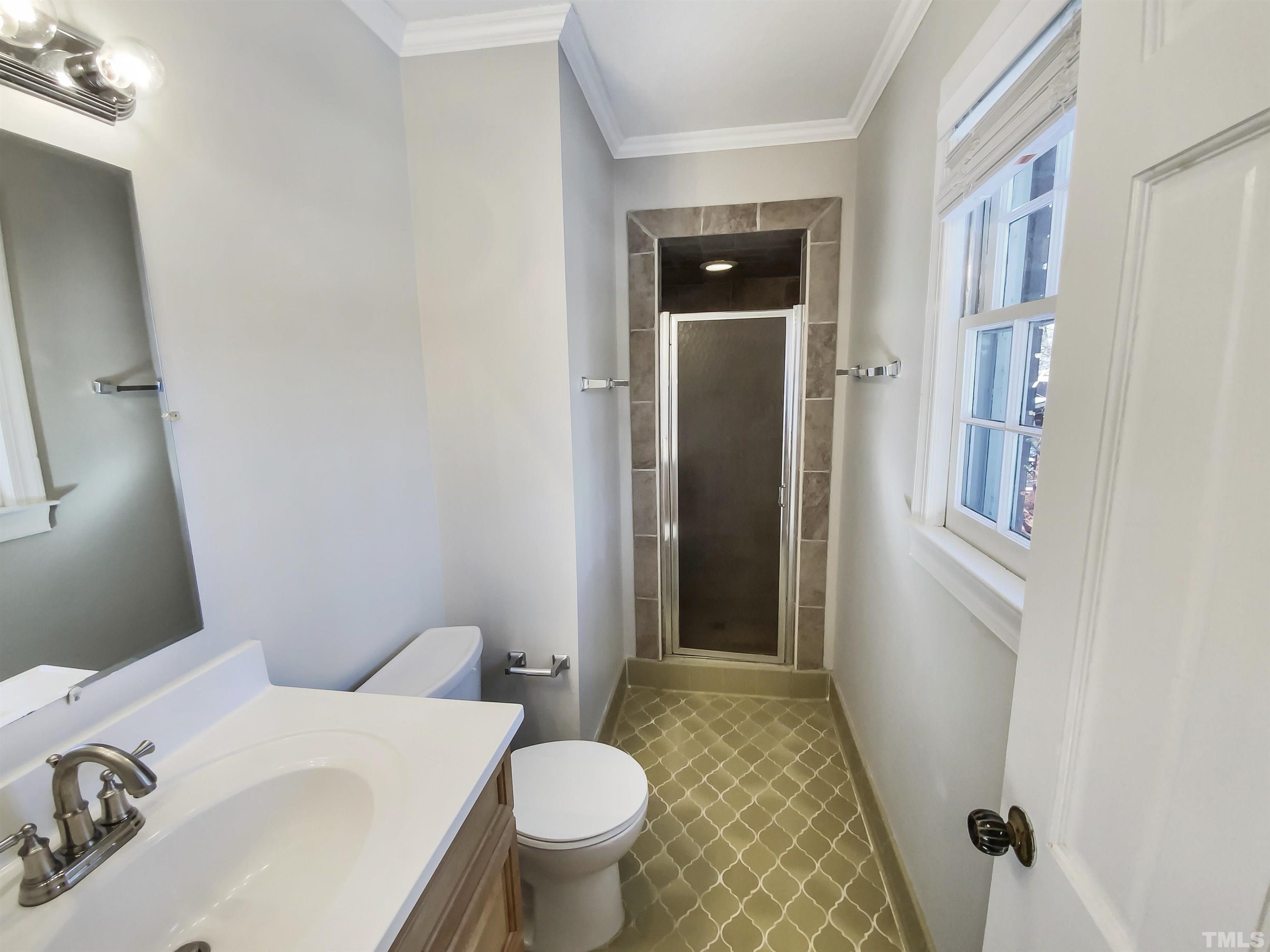3200 Caldwell Drive Raleigh, NC 27607 - Photo 16 of 19 a bathroom with a sink toilet and shower