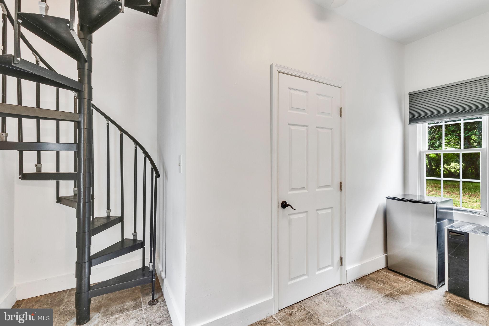 3952 Irvington Road Irvington, VA 22480 - Photo 21 of 77 Spiral staircase to 2nd floor