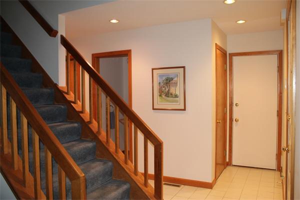 61 Stephanie Circle Springfield, MA 01129 - Photo 9 of 16 a view of staircase with wooden floor and a chandelier
