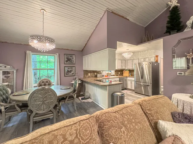 a view of a dining room with furniture window and outside view