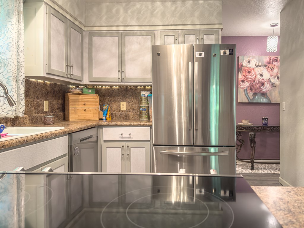 89 Box Turtle Lane Murphy, NC 28906 - Photo 30 of 55 a kitchen with a refrigerator and white cabinets