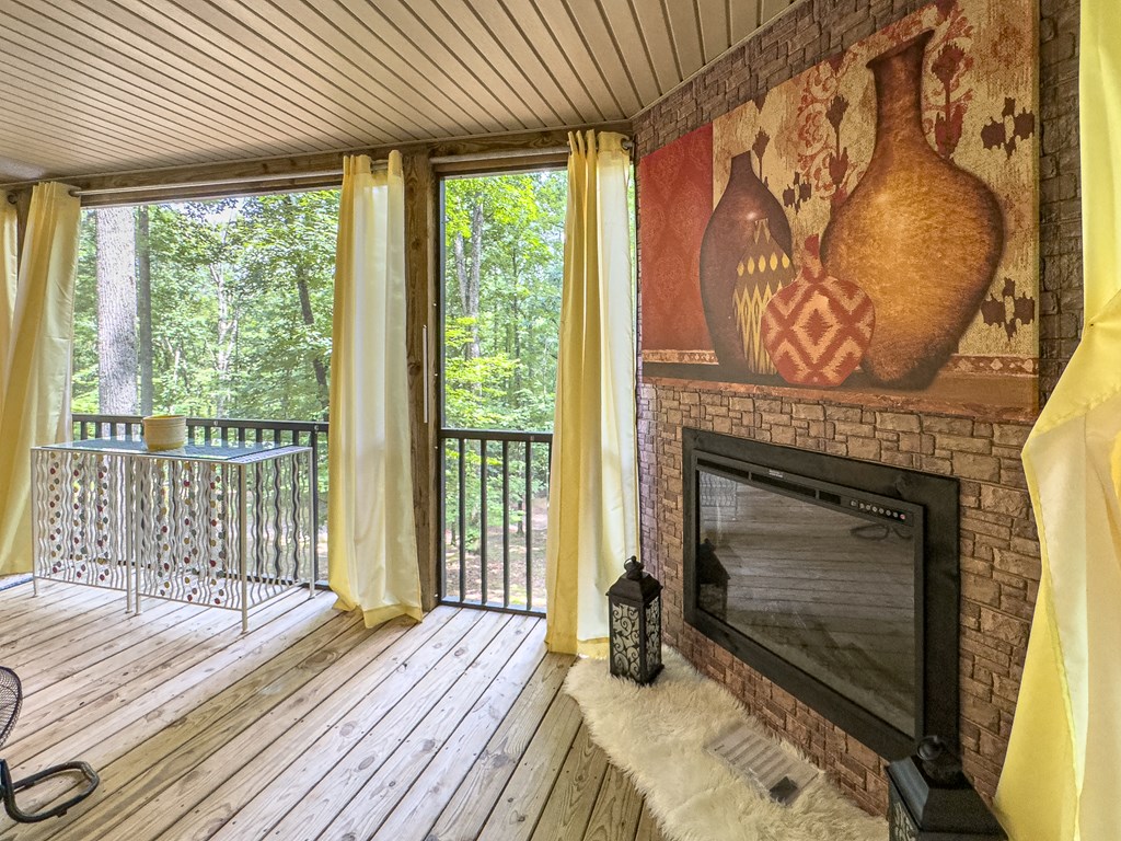 89 Box Turtle Lane Murphy, NC 28906 - Photo 4 of 55 a bedroom with a bed and a fireplace