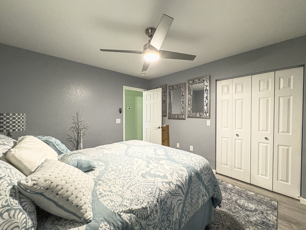 89 Box Turtle Lane Murphy, NC 28906 - Photo 42 of 55 a bedroom with a large bed and a chandelier