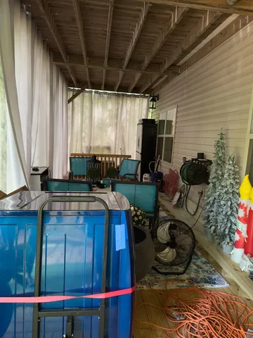 a living room with a couch wooden floor and a table