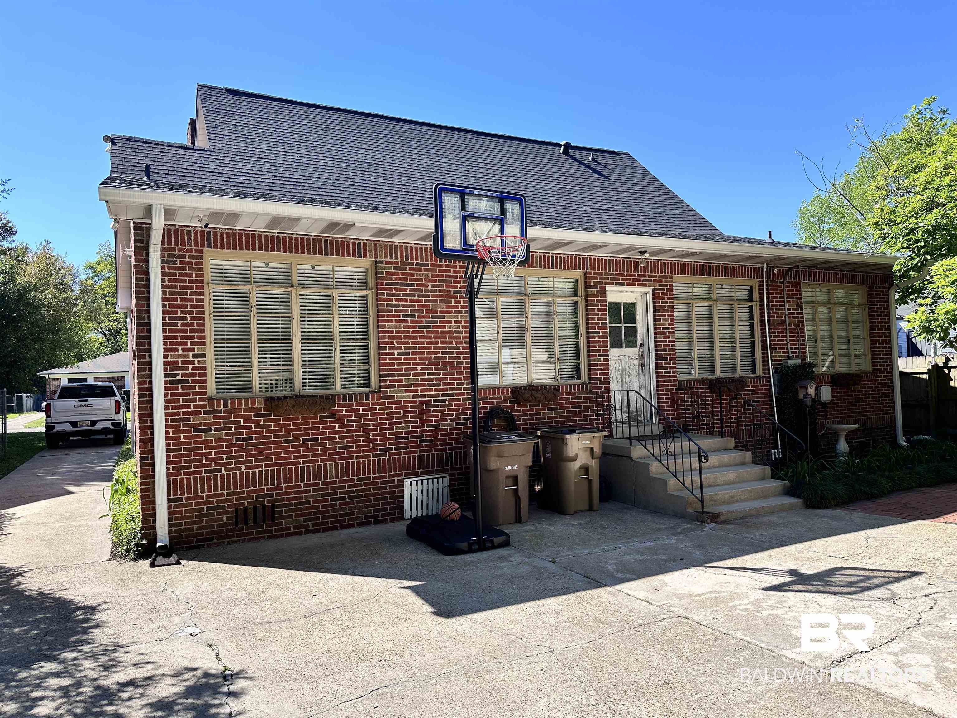260 Siena Vista Street Mobile, AL 36607 - Photo 2 of 41 Back of property featuring brick siding and a shingled roof