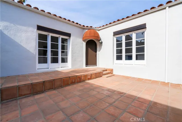 a view of a hallway with a washer and dryer