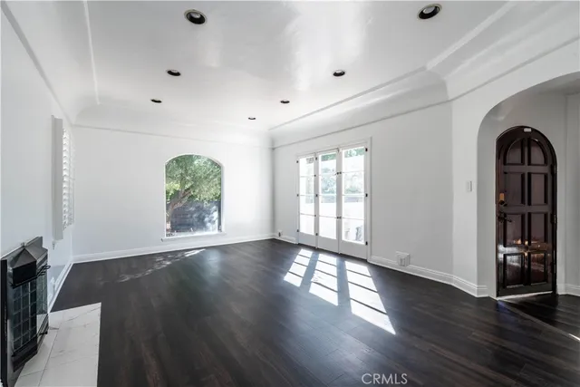 a bathroom with a granite countertop sink and a window