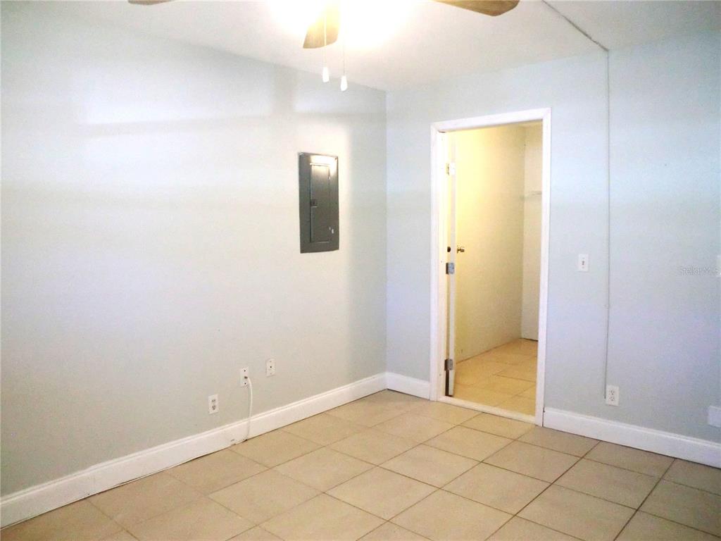 102 Cambridge Trail, Unit 229 Sun City Center, FL 33573 - Photo 13 of 18 an empty room with windows