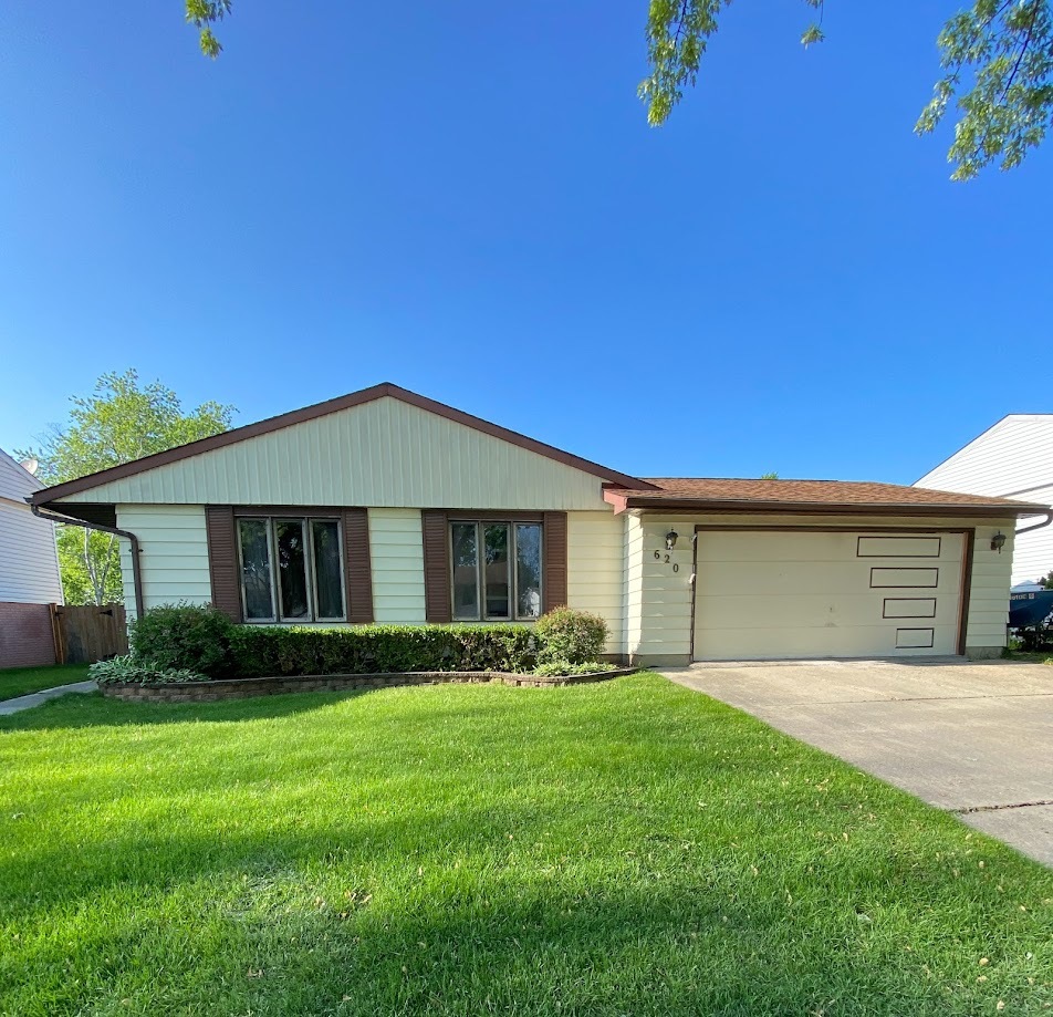 620 Sycamore Road Buffalo Grove, IL 60089 - Photo 1 of 21 a front view of house with yard and green space