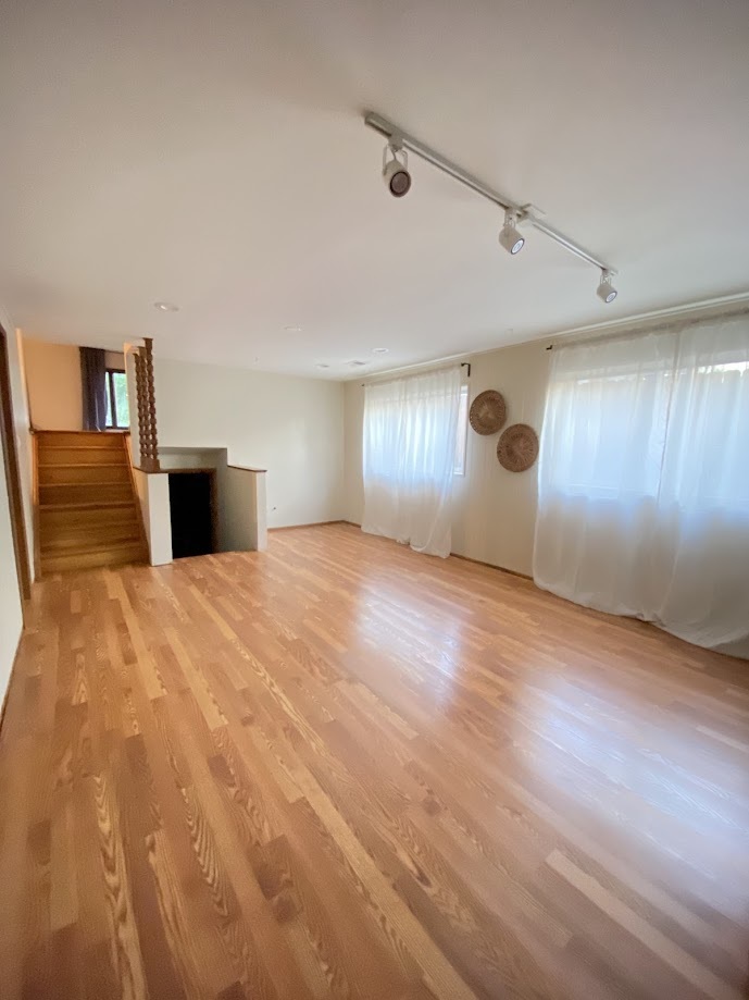 620 Sycamore Road Buffalo Grove, IL 60089 - Photo 13 of 21 a view of an empty room with window and wooden floor