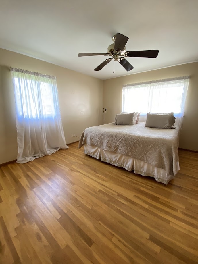 620 Sycamore Road Buffalo Grove, IL 60089 - Photo 6 of 21 a bedroom with a bed and window
