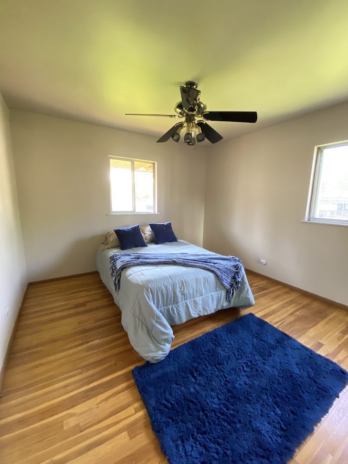 620 Sycamore Road Buffalo Grove, IL 60089 - Photo 10 of 21 a bedroom with a bed and a window