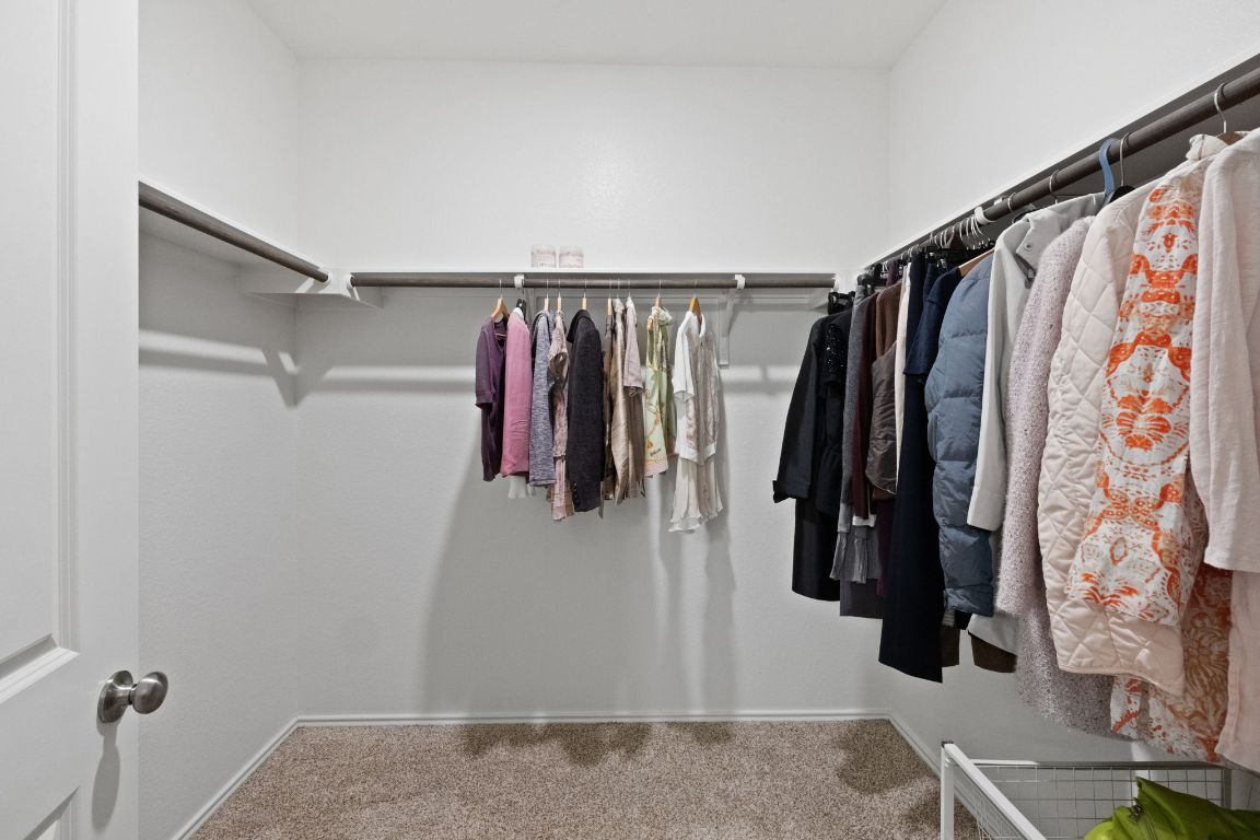7116 Spirit Hill Road Austin, TX 78744 - Photo 20 of 33 Spacious closet featuring light carpet