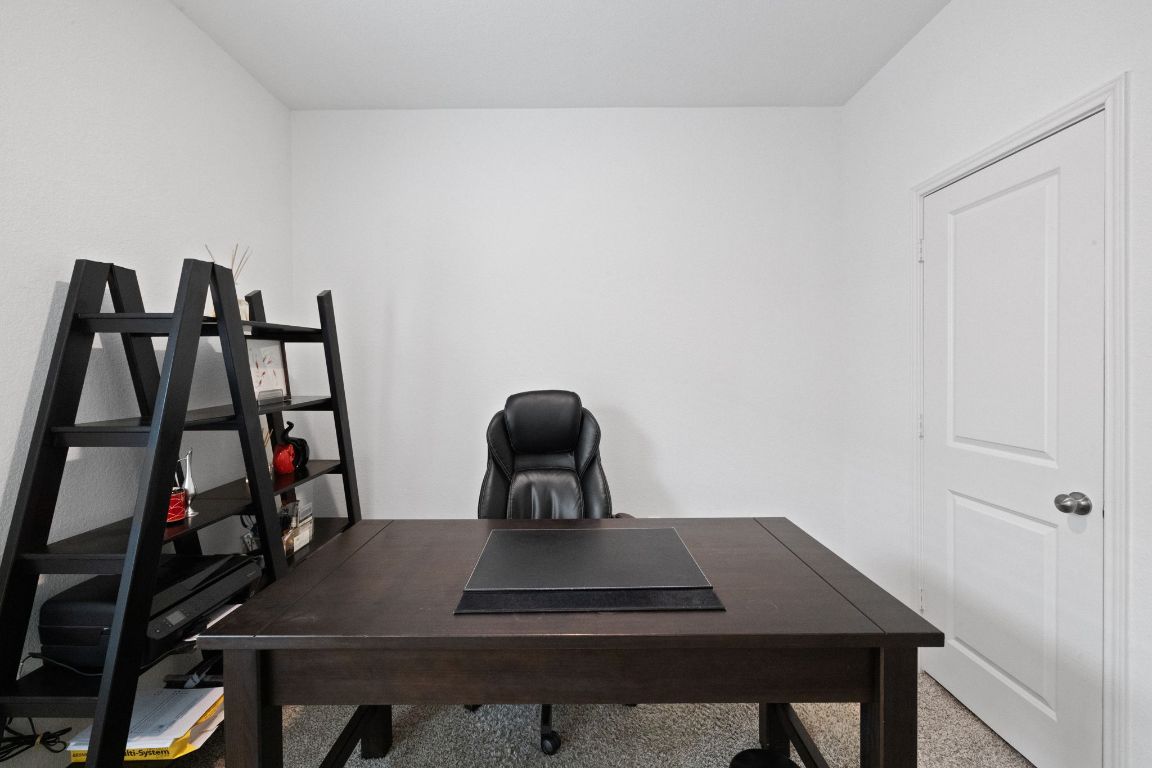 7116 Spirit Hill Road Austin, TX 78744 - Photo 27 of 33 Office space with carpet flooring