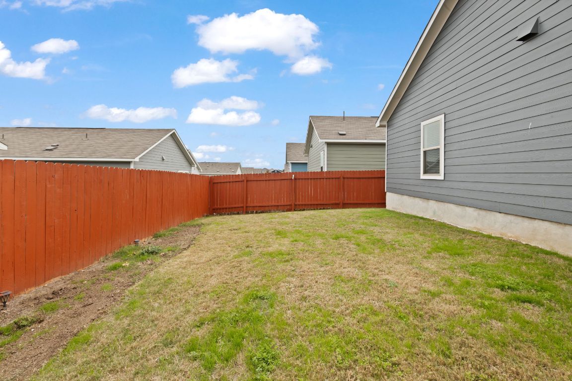 7116 Spirit Hill Road Austin, TX 78744 - Photo 29 of 33 View of fenced backyard