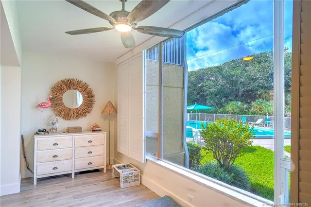 a cabinet with window and wooden floor